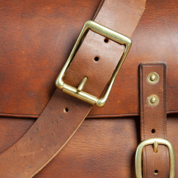 Premium Vegetable-Tanned Full Grain Leather Briefcase in Tan color, zoomed in strap buckle view