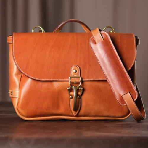 Premium Vegetable-Tanned Full Grain Saddle Tan color Leather Mailbag. Heavy duty Brass and Copper Hardware.