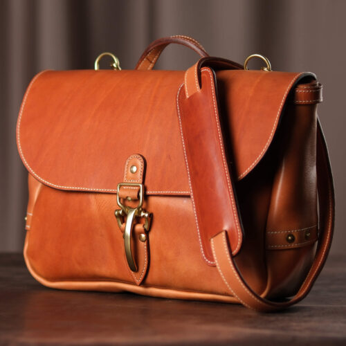 Premium Vegetable-Tanned Full Grain Saddle Tan color Leather Mailbag. Heavy duty Brass and Copper Hardware.