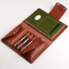 a leather journal for A5 notebooks or sketchbooks with three pen loops and two large pockets for tools and gadgets.