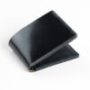 Shell cordovan wallet, black color, closed.