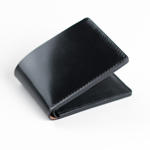 Shell cordovan wallet, black color, closed.