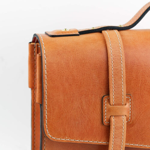Leather Briefcase, tan color, zoomed in flap view.