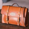 Leather Briefcase, tan color, front left view.